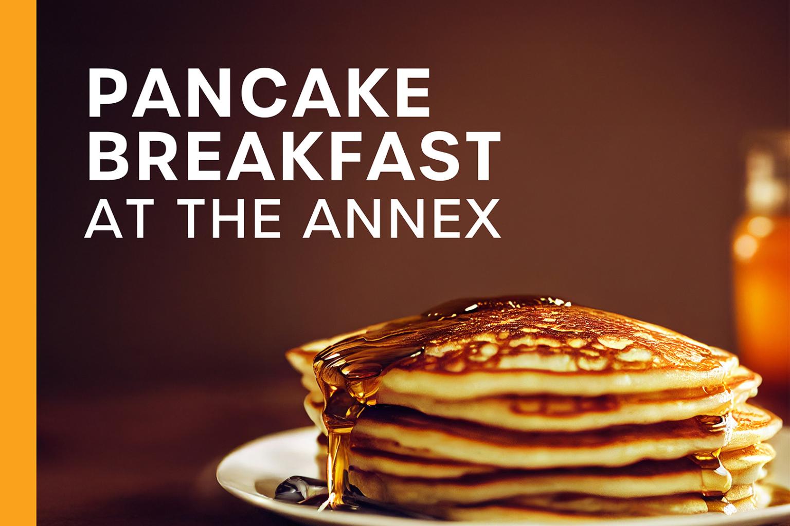 Stack of pancakes with syrup on a plate.