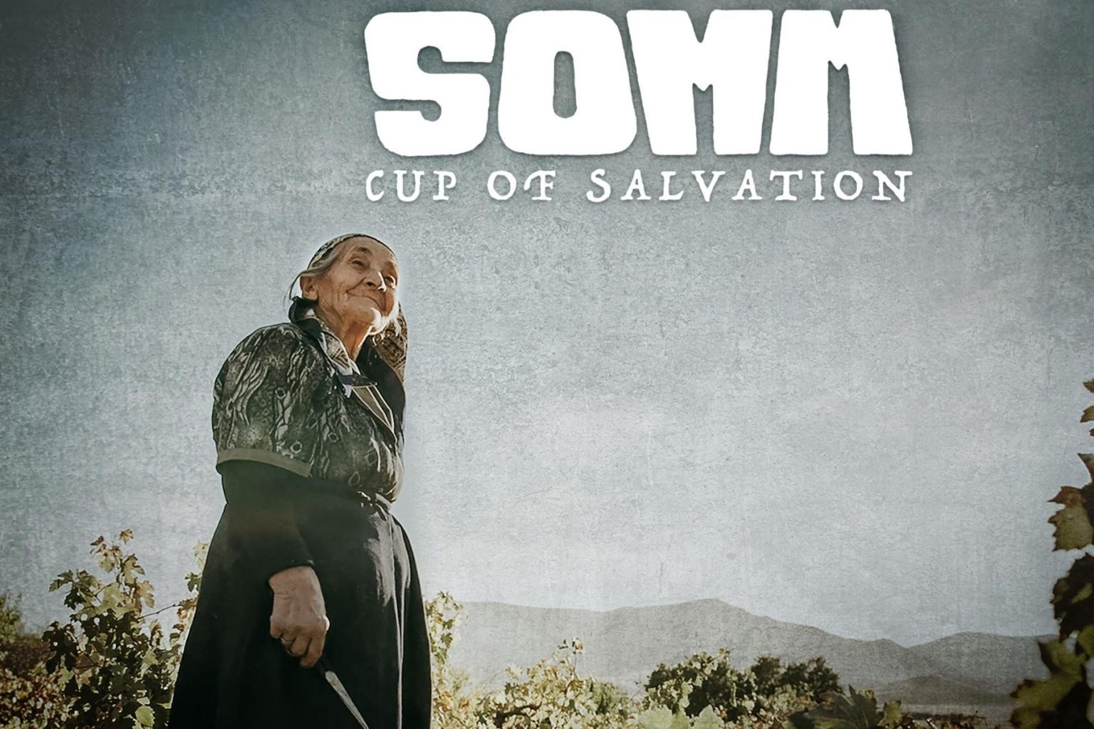Elderly woman holding a basket in a vineyard under a cloudy sky -  SOMM Cup of Salvation.