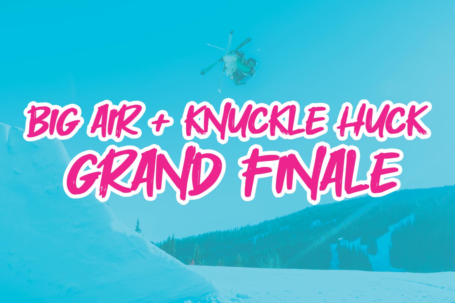 Snowboarder mid-air with blue sky and snowy landscape.