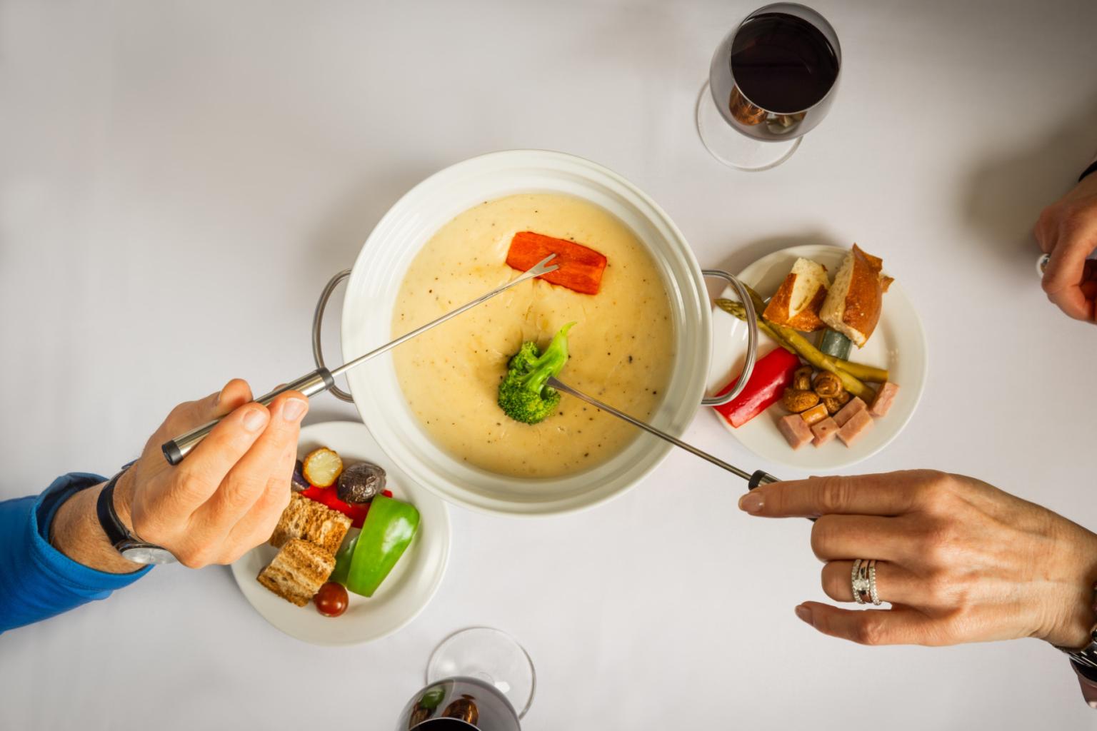 Fondue pot with people dipping
