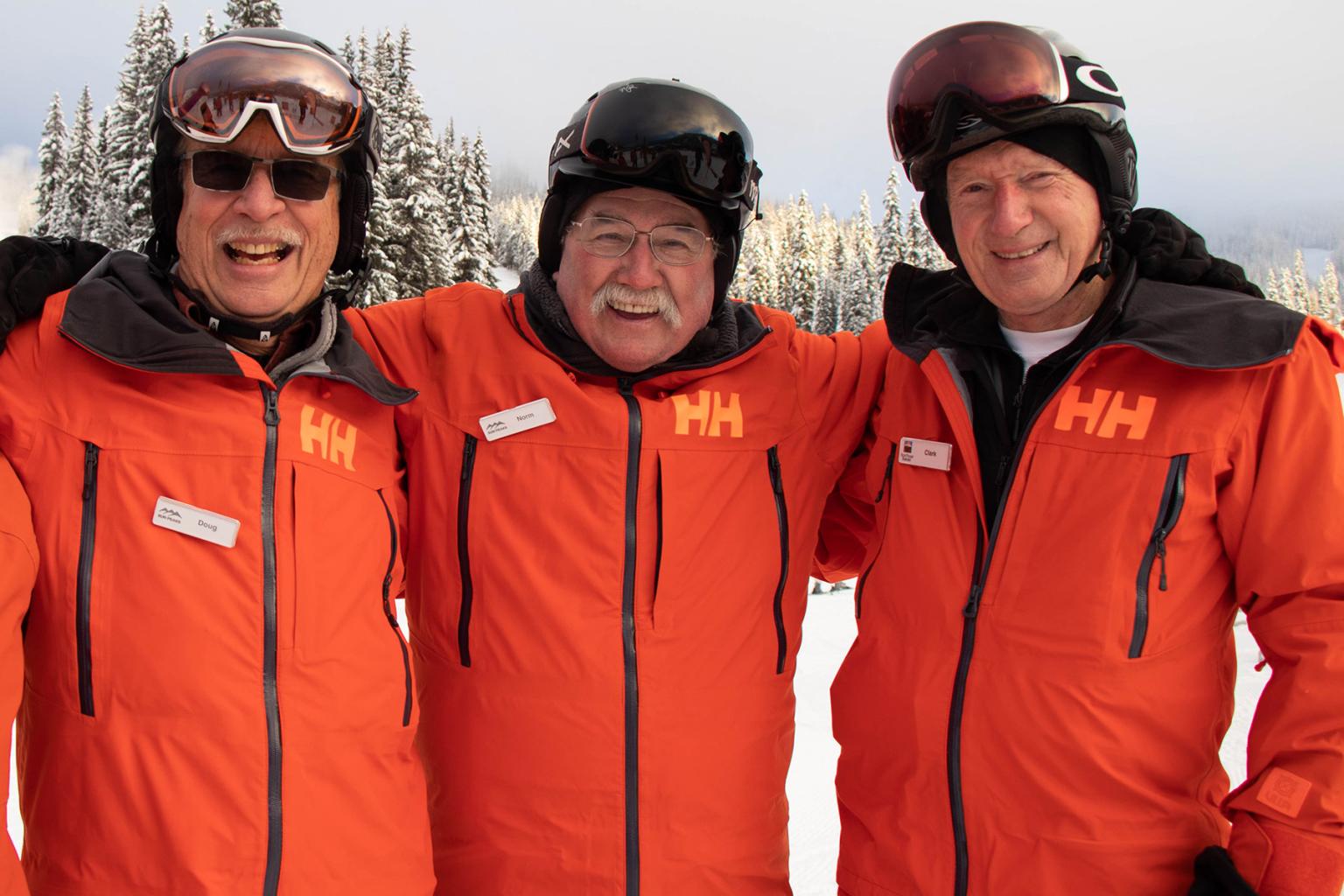 Three Sun Hosts smiling for the camera
