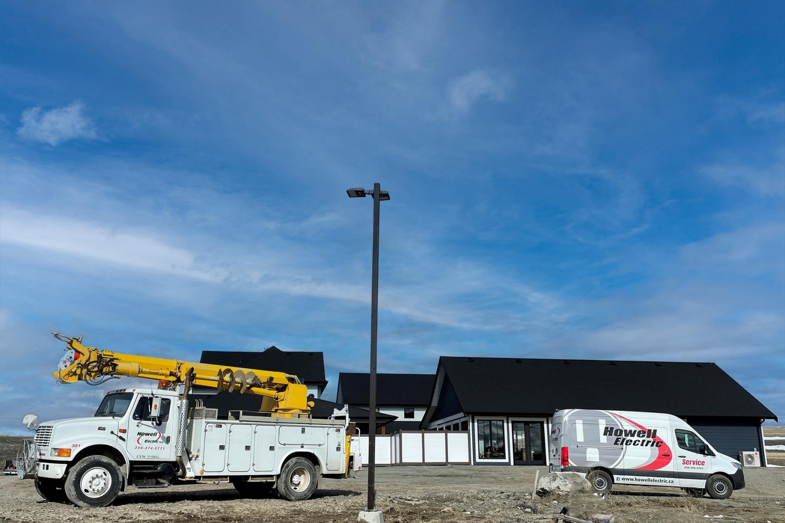Howell Electrical service vehicles on location