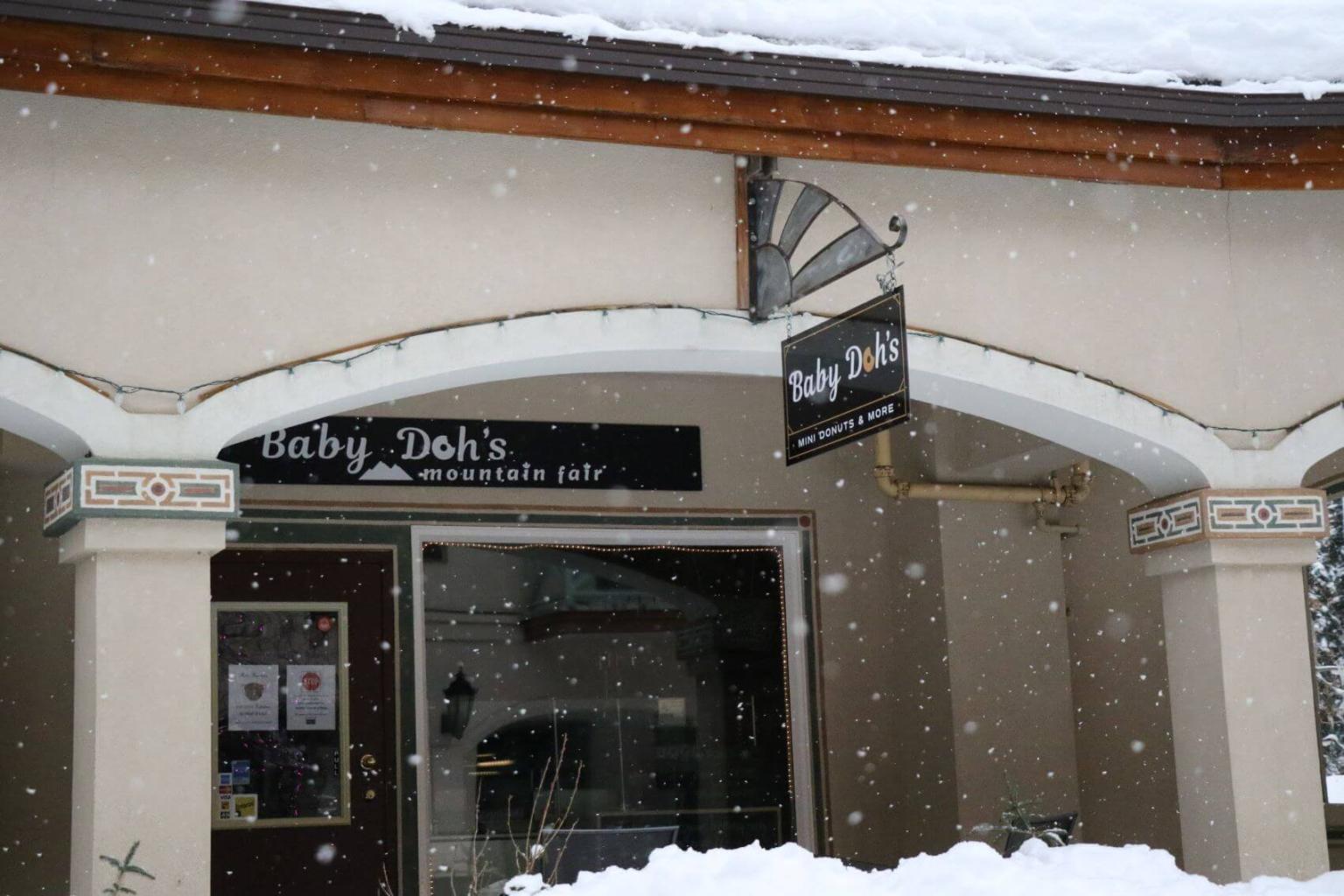 A view from outside of Baby Dohs in the winter with snow 