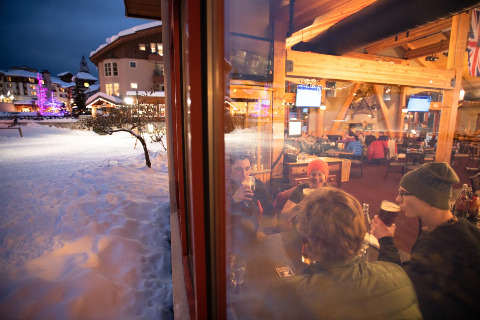 People sitting at a table in Masas drinking and eating