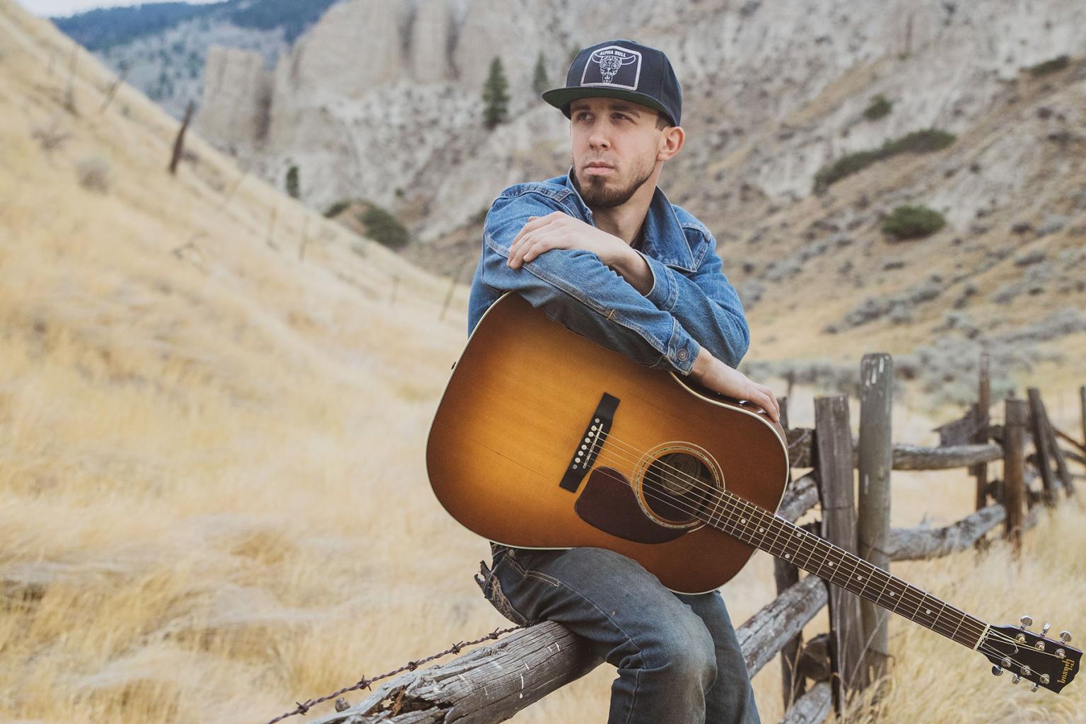 A man holding a guitar