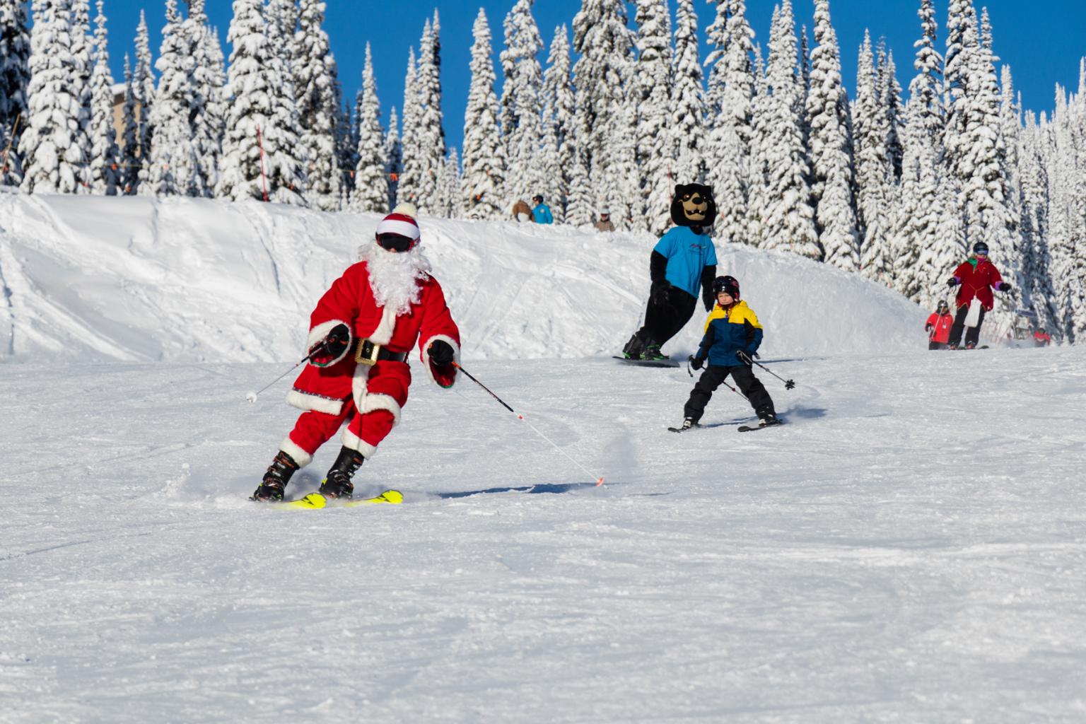 Santa skiing with kids and Harry Bear